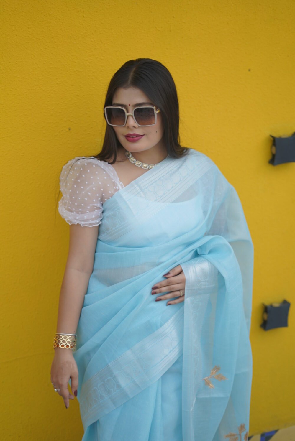 Attractive Kota Doriya Sky Blue Saree adorned with elegant golden flowers on the pallu & silver border
