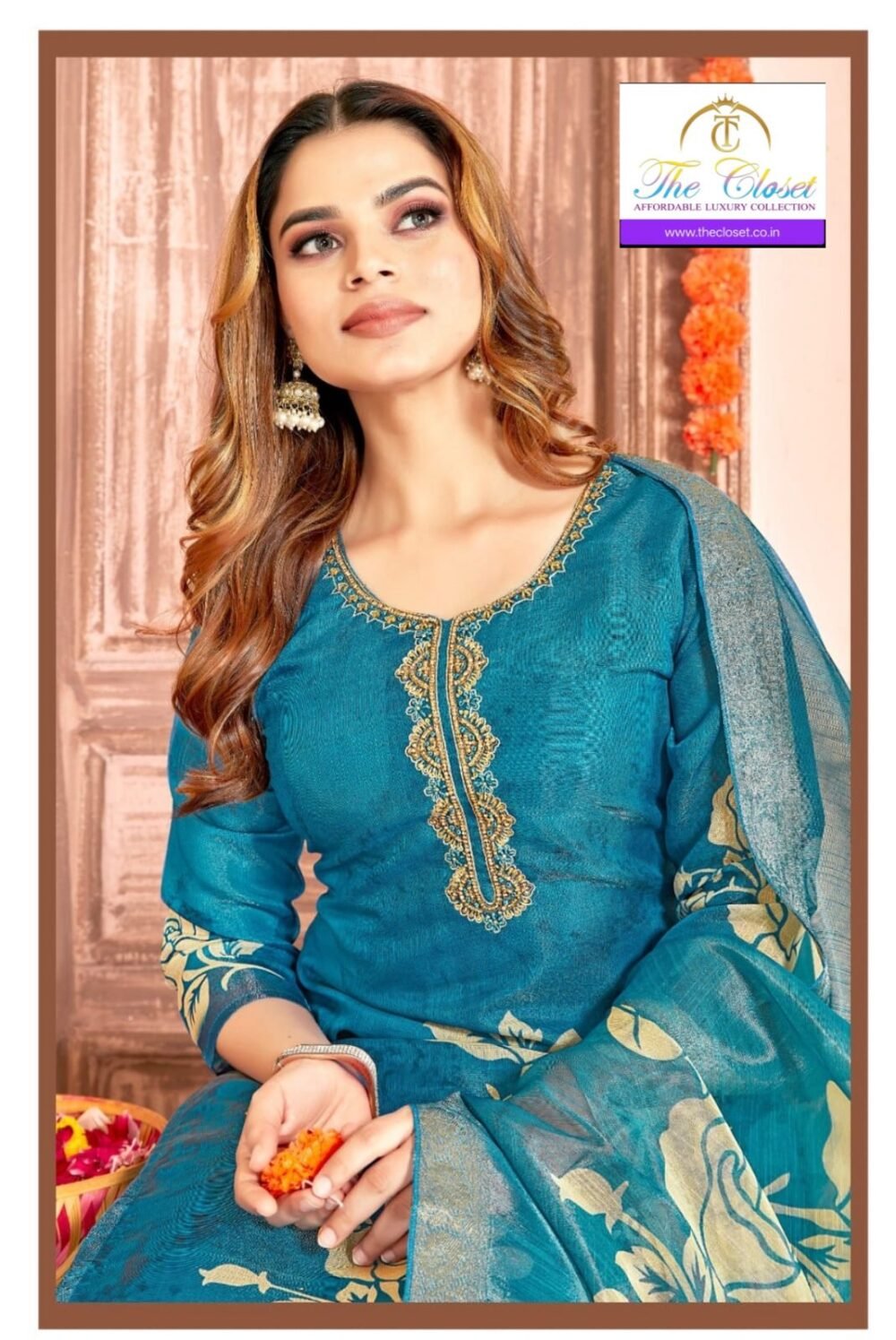 A Graceful Women’s Suit Set featuring Intricate Neck Embroidery Work