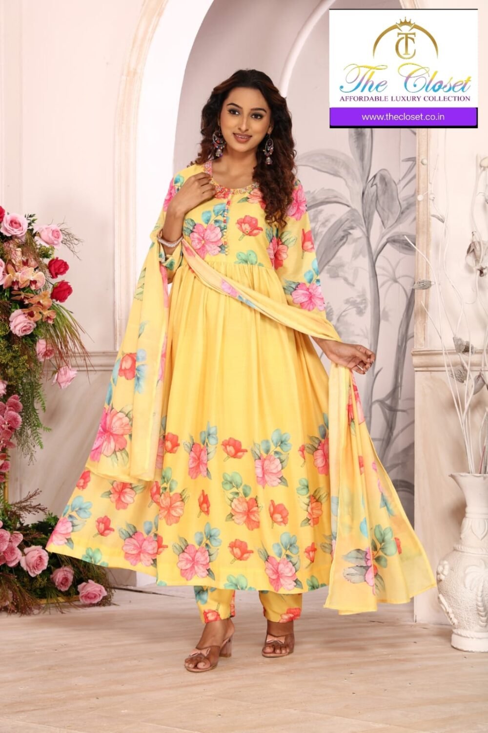 A beautiful floral print suit set paired with matching pants and a graceful dupatta